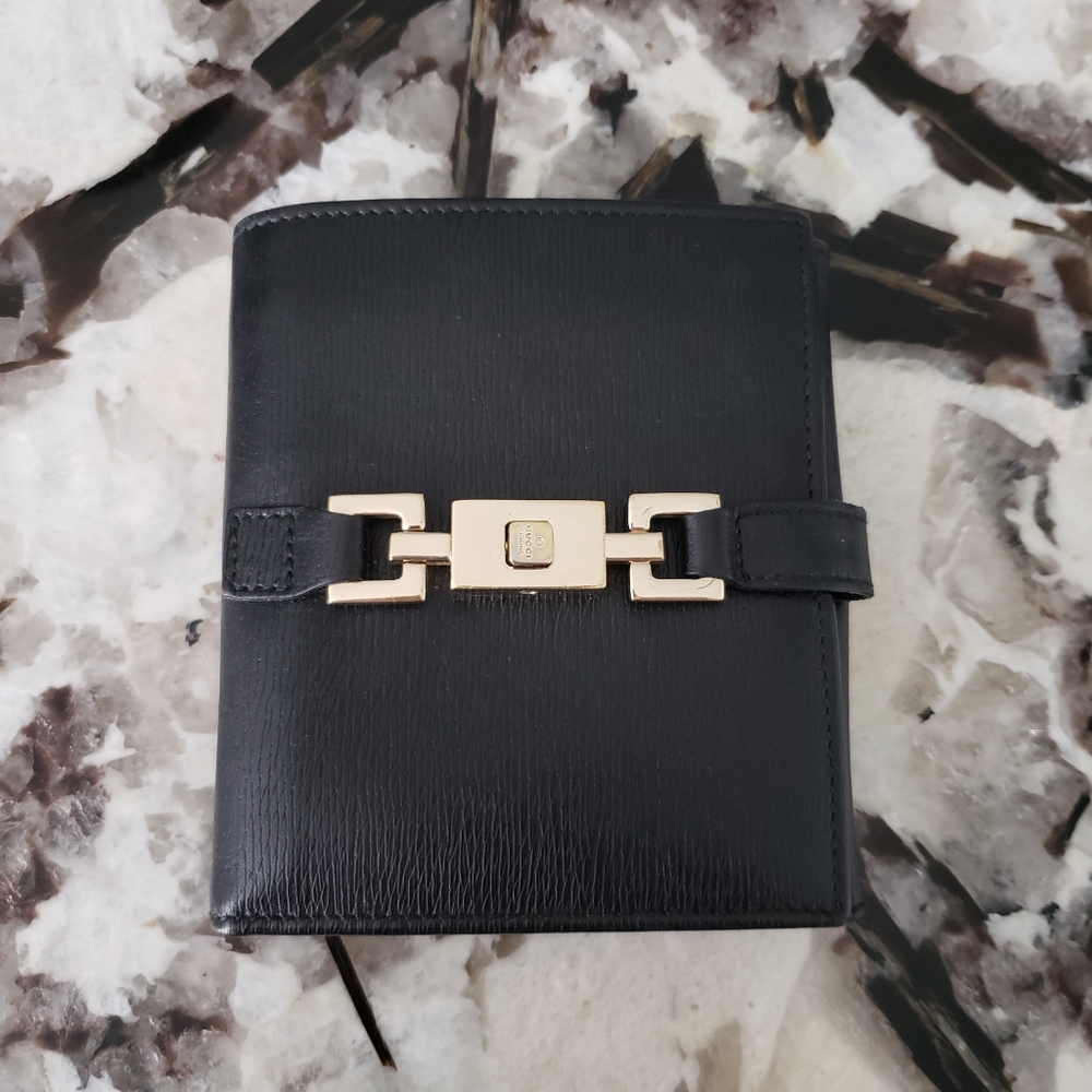 Sold. Gucci black textured leather wallet, vintage